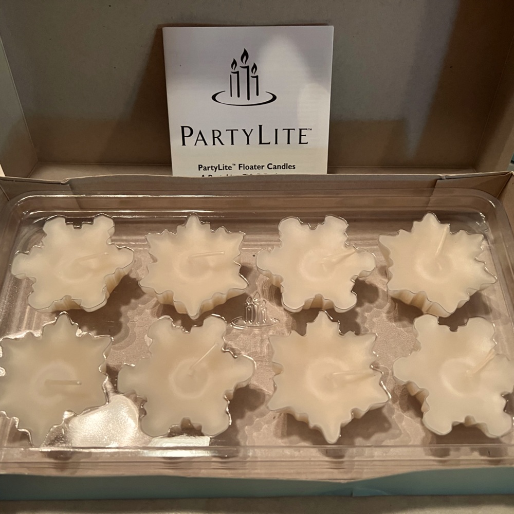 PartyLite floating candles. Ivory New in the box. Box shows some wear